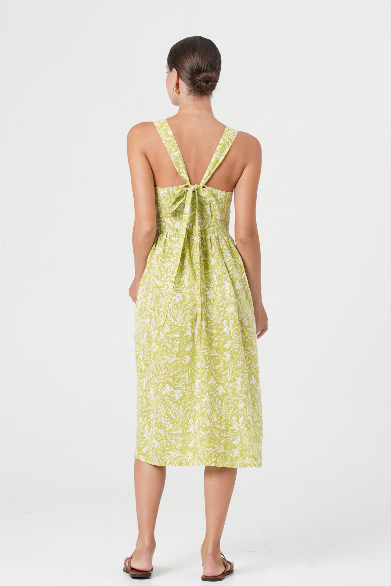 Back view of the Amara Linen Dress Jungle Leave Light Green highlighting the garment shape and drape