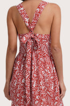Close up detail of the Amara Linen Dress Jungle Leave Red Brick highlighting craftsmanship and design features