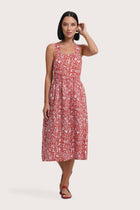 Woman wearing the Amara Linen Dress Jungle Leave Red Brick designed for effortless resortwear and tropical living by By The Sea Bali