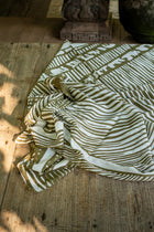 Tropical resort styling featuring the Amaya Sarong in Stripe Island
