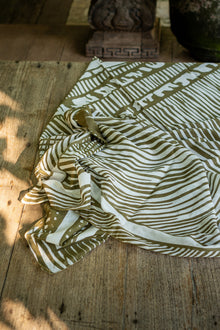 Tropical resort styling featuring the Amaya Sarong in Stripe Island