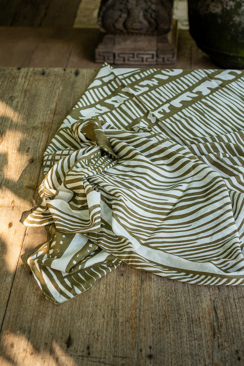 Tropical resort styling featuring the Amaya Sarong in Stripe Island