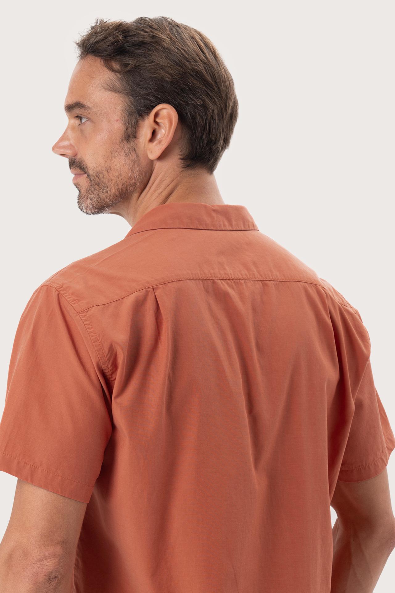 Open collar and button-front detail of the Andres Shirt Terracota by By The Sea Bali
