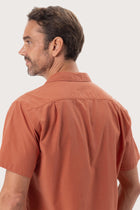 Open collar and button-front detail of the Andres Shirt Terracota by By The Sea Bali