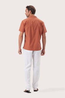 Back view of the Andres Shirt Terracota showcasing its tailored finish by By The Sea Bali