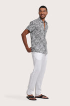 Side profile of the Angkasa Linen Shirt Flower Bloom in Grey highlighting its easy, breathable fit by By The Sea Bali