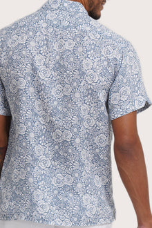 Open collar and button-front detail of the Angkasa Linen Shirt Flower Bloom in Light Blue by By The Sea Bali