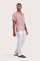 Side profile of the Angkasa Linen Shirt Jungle Leaves in Red Brick highlighting its easy, breathable fit by By The Sea Bali