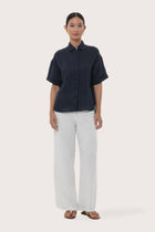  By The Sea Bali Anse Short Sleeve Linen Blouse featuring a relaxed silhouette and effortless resort elegance