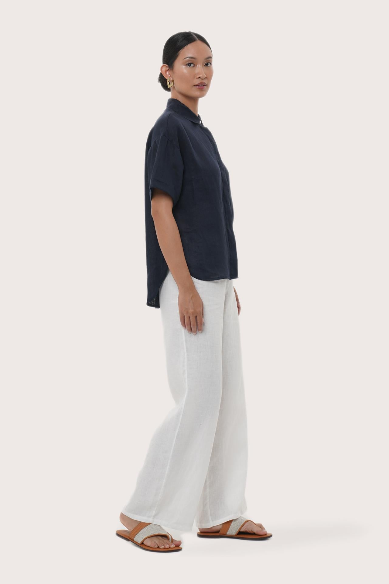 By The Sea Bali Side profile of the Anse Short Sleeve Linen Blouse showcasing its relaxed fit and fluid drape