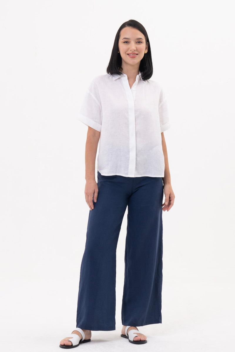 The Anse Short Sleeve Linen Blouse White featuring a relaxed silhouette and effortless resort elegance by By The Sea Bali 