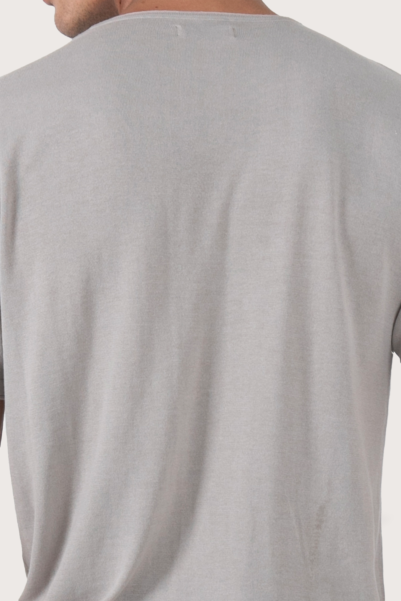 Back detail of the Arco Cotton Knit T-shirt Creme by By The Sea Bali – premium stitching and artisan quality