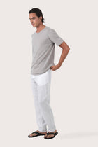 Side profile of the Arco Cotton Knit T-shirt Creme by By The Sea Bali – relaxed drape and understated island elegance