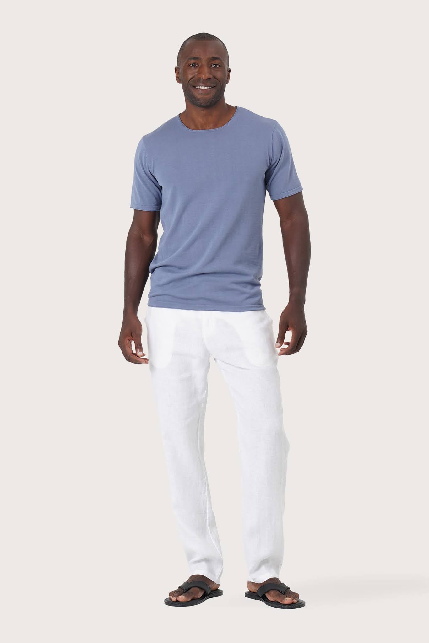Arco Cotton Knit T-shirt Denim Blue by By The Sea Bali – angled front view showcasing the tailored island silhouette