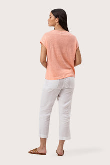 Back view of the Aria Linen T-Shirt Peach highlighting the garment shape and drape.