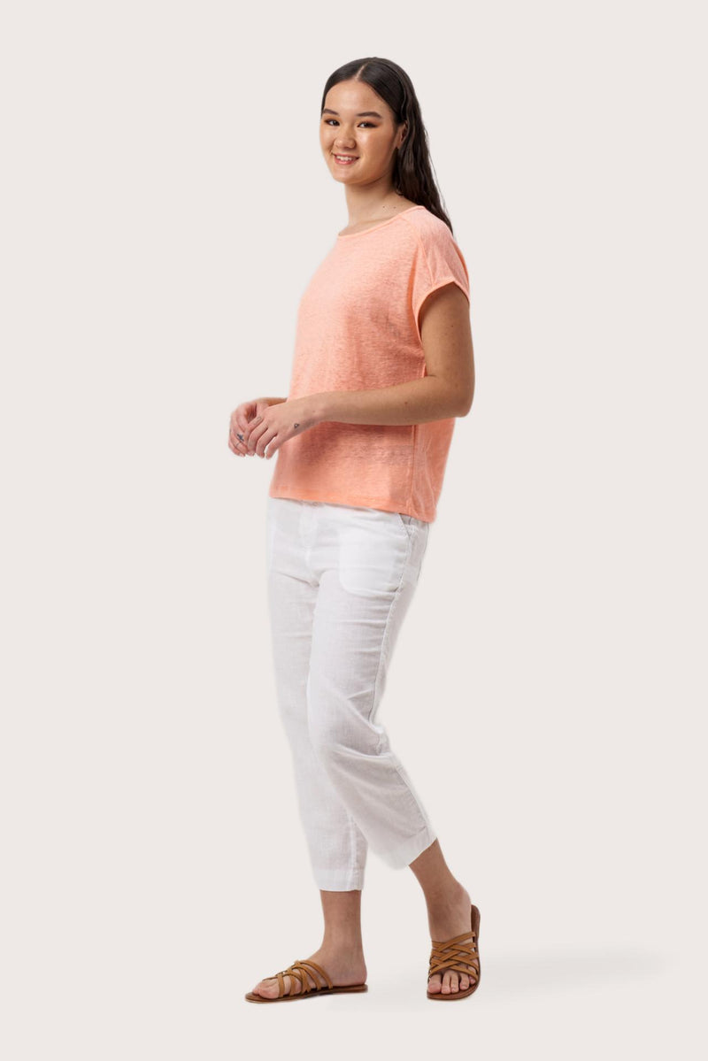 Side profile of the Aria Linen T-Shirt Peach showing its cut and natural movement.