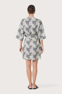 Back view of the Arumba Linen Dress Heart Leaves highlighting the garment shape and drape