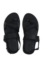 Arus sandal shown in a global view highlighting its full silhouette and refined resort-ready design