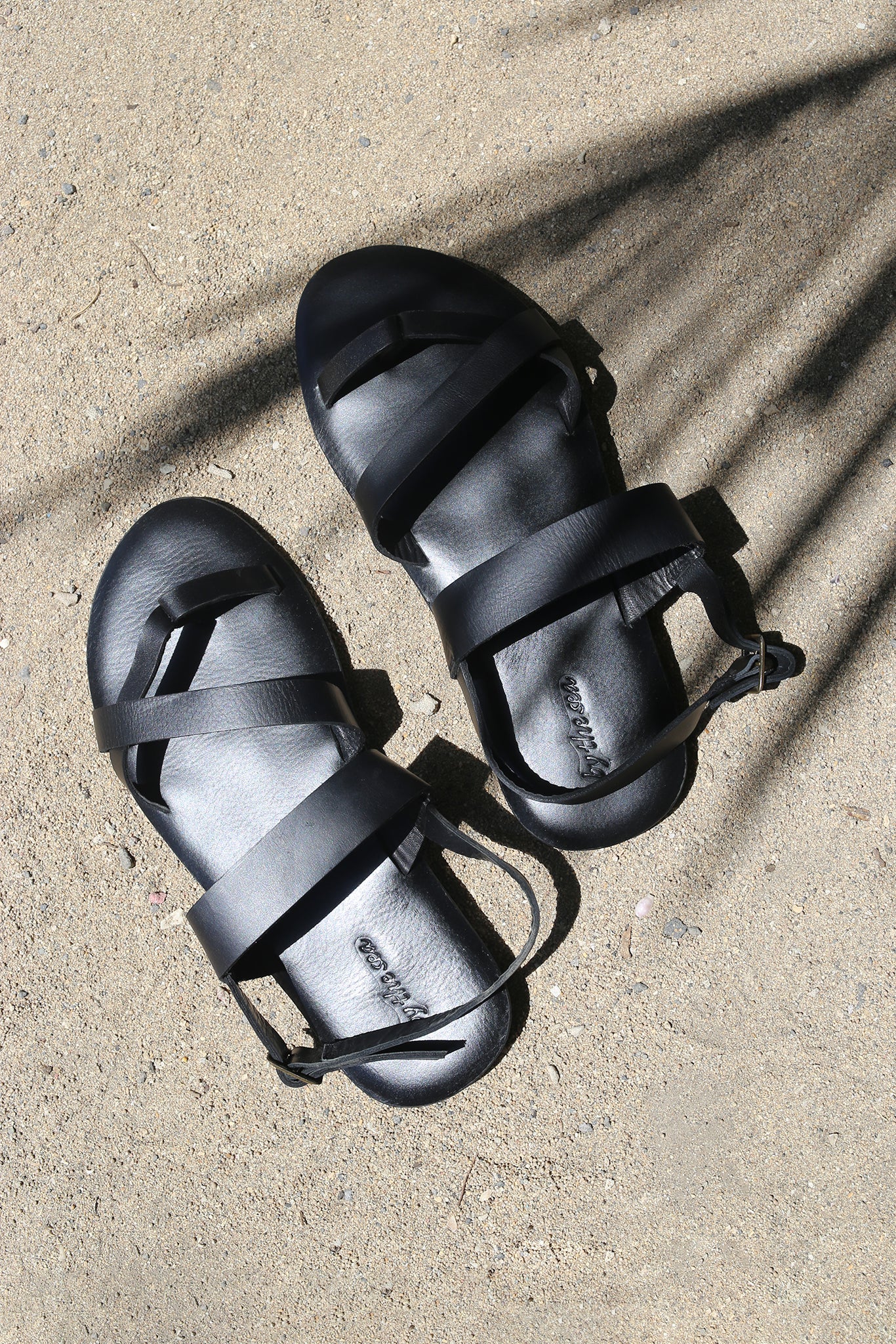 Arus sandal styled on foot in a tropical resort setting with effortless coastal elegance