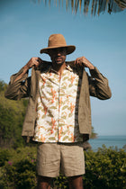 Men's resortwear styling featuring the Asa Loose Fit Shirt Begonia in Green by By The Sea Bali