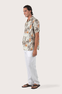 Side-angle view of the Asa Loose Fit Shirt Rustic Pineapple in Grey showing its relaxed drape by By The Sea Bali