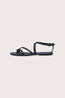 Side profile of Astola sandal in navy highlighting sleek and modern resort footwear silhouette