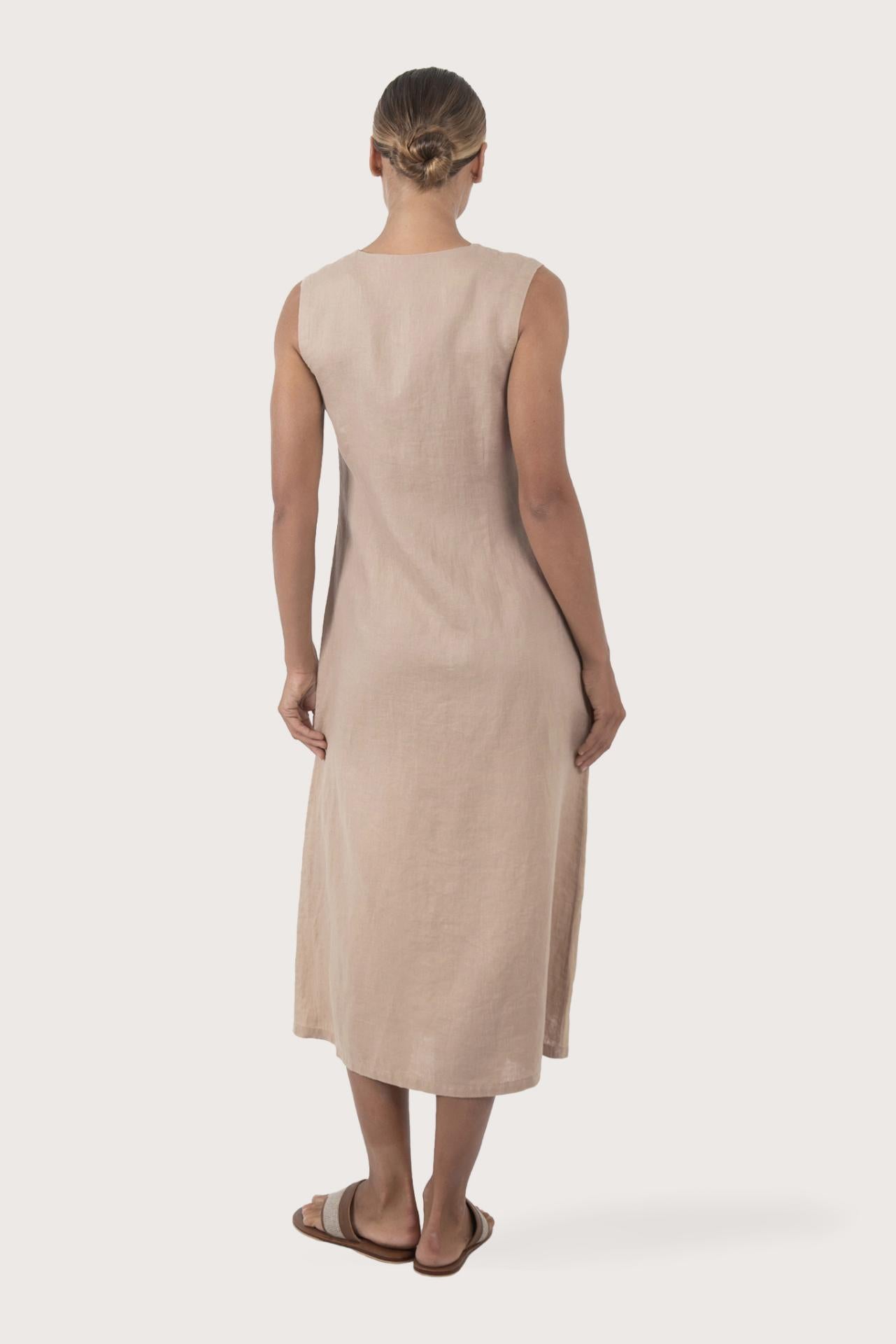 Back view of the Ayu Linen Maxi Dress Nude highlighting the garment shape and drape