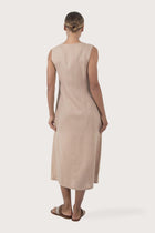 Back view of the Ayu Linen Maxi Dress Nude highlighting the garment shape and drape