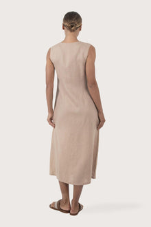 Back view of the Ayu Linen Maxi Dress Nude highlighting the garment shape and drape