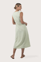 Back view of the Ayu Linen Maxi Dress Pastel Green highlighting the garment shape and drape
