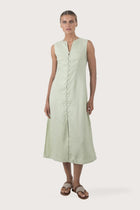 Woman wearing the Ayu Linen Maxi Dress Pastel Green designed for effortless resortwear and tropical living by By The Sea Bali