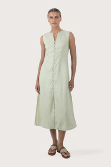 Woman wearing the Ayu Linen Maxi Dress Pastel Green designed for effortless resortwear and tropical living by By The Sea Bali