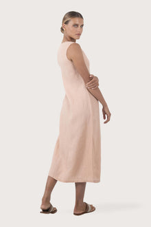 Back view of the Ayu Linen Maxi Dress Pastel Pink highlighting the garment shape and drape