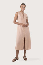 Woman wearing the Ayu Linen Maxi Dress Pastel Pink designed for effortless resortwear and tropical living by By The Sea Bali