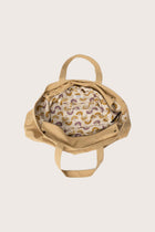 Interior view of the creme Barcha tote bag showing the printed lining