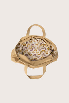 Interior view of the creme Barcha tote bag showing the printed lining