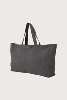 Angled view of the dark brown Barcha tote bag showcasing its spacious design
