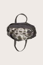 Interior view of the dark brown Barcha tote bag showing the printed lining