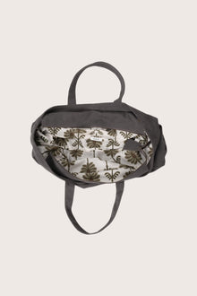 Interior view of the dark brown Barcha tote bag showing the printed lining
