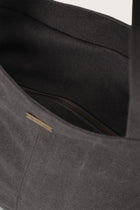Close-up of the zipper and polyester cotton fabric on the dark brown Barcha tote bag