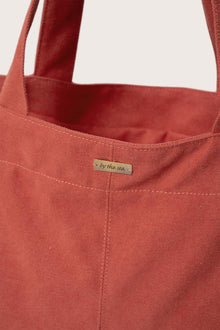 Close-up of the polyester cotton fabric on the red Barcha tote bag