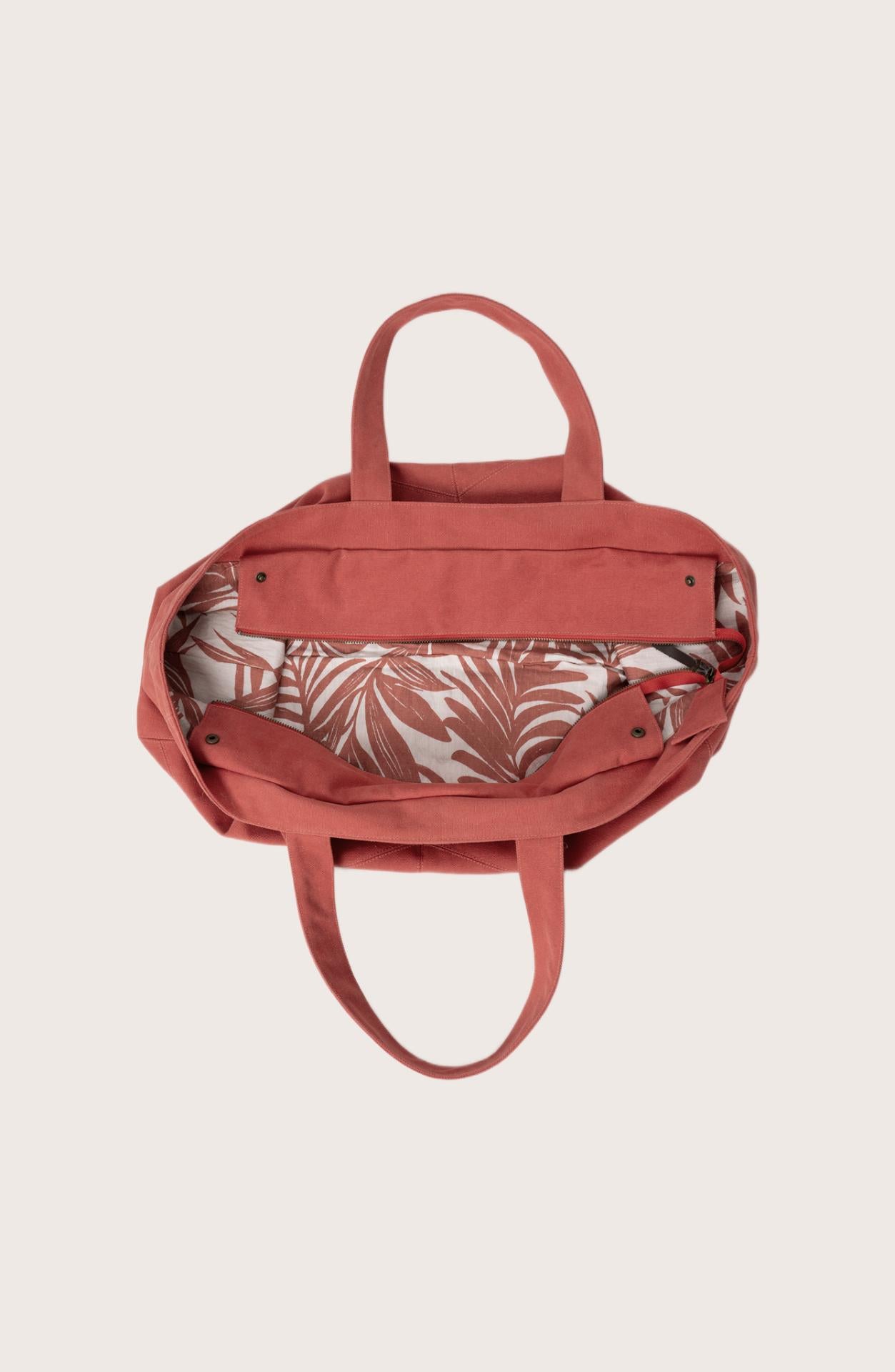 Interior view of the red Barcha tote bag showing the printed lining