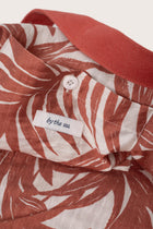 Close-up of the interior lining and stitching details of the red Barcha tote bag