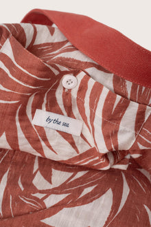 Close-up of the interior lining and stitching details of the red Barcha tote bag
