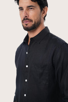 Side profile of the Baron Linen Shirt in Black highlighting the easy, breathable fit by By The Sea Bali