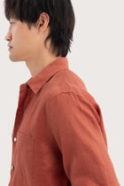 Open collar and button-front detail of the Baron Linen Shirt Brick by By The Sea Bali