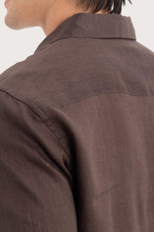 Open collar and button-front detail of the Baron Linen Shirt Brown by By The Sea Bali