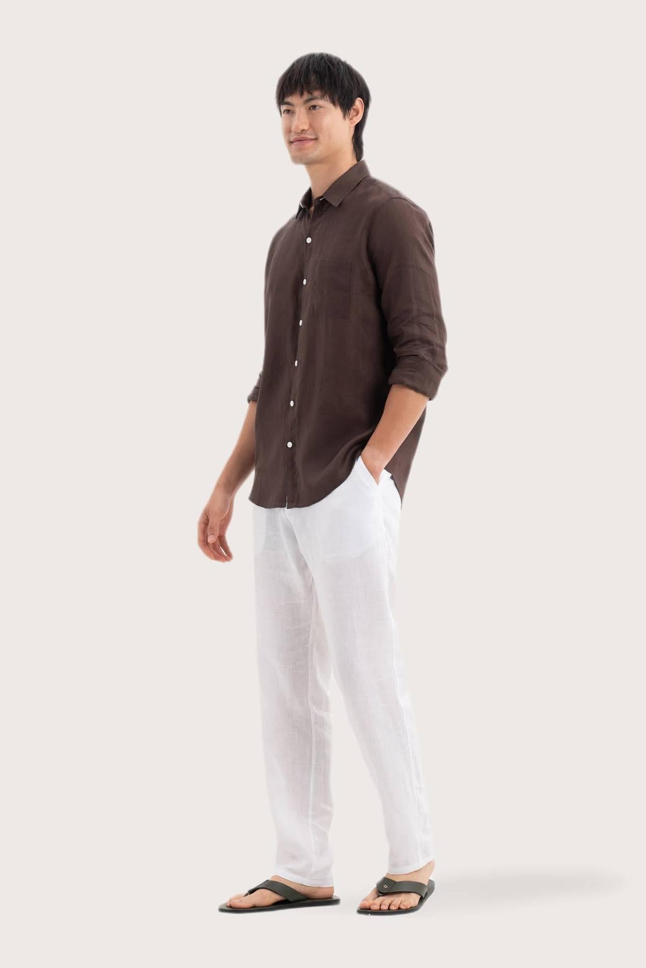 Side profile of the Baron Linen Shirt Brown highlighting its easy, breathable fit by By The Sea Bali