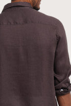 Open collar and button-front detail of the Baron Linen Shirt Choco by By The Sea Bali