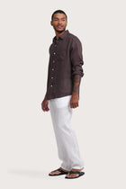 Side profile of the Baron Linen Shirt Choco highlighting its easy, breathable fit by By The Sea Bali